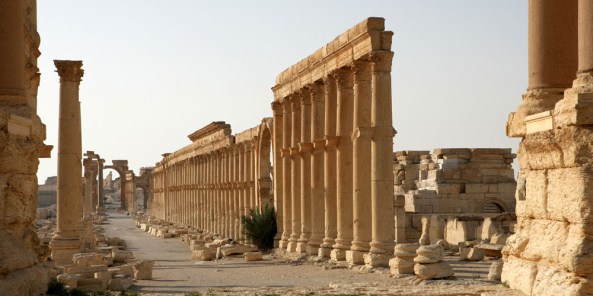 Along the Cardo Maximus or main street, 1.2 kms in length with porticoes at each end, 2nd century AD, Palmyra, Syria. Monumental arch in the distance. In Roman city-planning, the Cardo Maximus runs north-south, intersecting with the east-west Decumanus Maximus Picture by Manuel Cohen